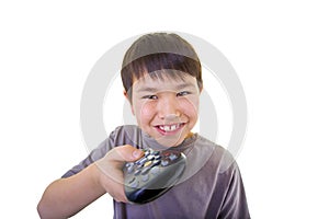 Cute young boy using the remote control isolated