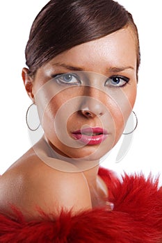 Cute young brunette girl portrait in red isolated