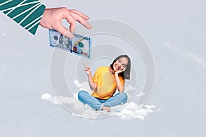 Cute young business lady sitting dreamy clouds pointing finger banknote dollar become rich collect more isolated on grey