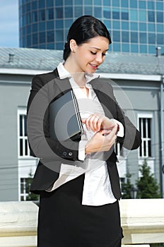 Cute young businesswoman looking