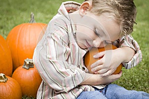 Cute Young Child Boy Enjoying the Pumpkin Patch.