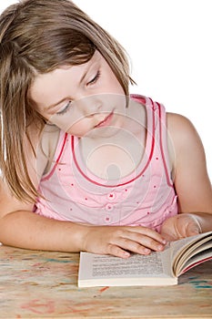 Cute Young Child Reading her Book