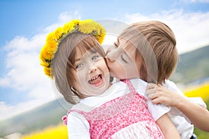 Cute young children kissing