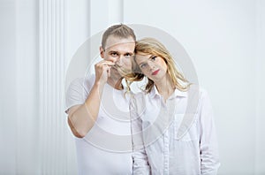 Young couple fooling around indoors photo