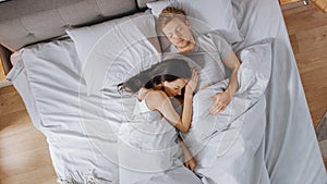 Cute Young Couple Sweetly Sleeping in the Bed, Girl Tenderly Cuddling and Emracing Her Boyfriend w