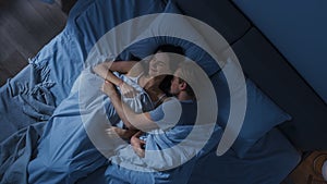 Cute Young Couple Sweetly Sleeping in the Bed, Men Tenderly Cuddling and Embracing Her Smiling Gir
