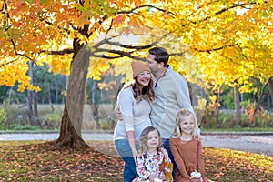 Cute young family with two little girls