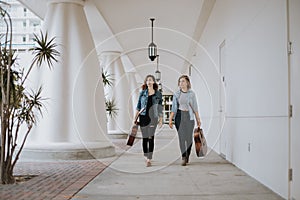 Cute Young Female Musician Friends Modeling in an Outdoor Hallway Corridor