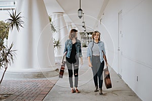 Cute Young Female Musician Friends Modeling in an Outdoor Hallway Corridor