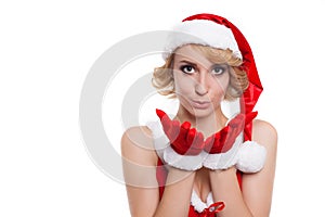 Cute young female in red santa hatand costume a kiss at you agai