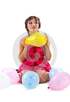 Cute young girl with balloons