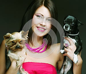 Cute young girl with her Yorkie puppy