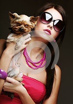 Cute young girl with her Yorkie puppy