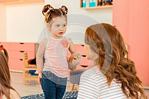 Cute young girl holding her favoutire toy