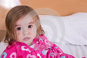 Cute young girl just awoken from her sleep