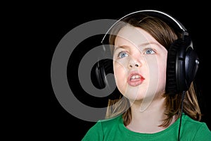 Cute Young Girl Singing with Headphones