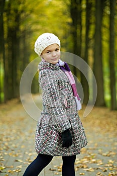 Cute young girl standing turned backwards