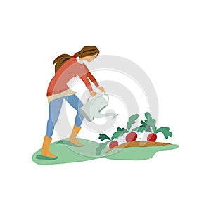 Cute young girl is use watering can to wet radish