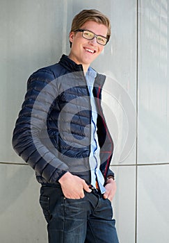 Cute young man smiling with glasses