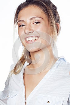 Cute young pretty girl thinking on white background isolated close up smiling