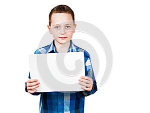 Cute young smiling schooler boy hold blank sign with copy space isolated on white background