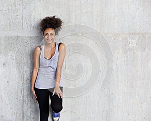 Cute young sports woman smiling with earphones