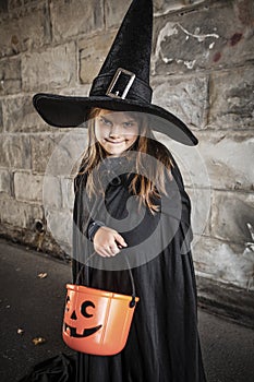 Cute young witch for Halloween