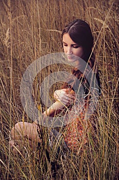 Cute young woman in the autumn field