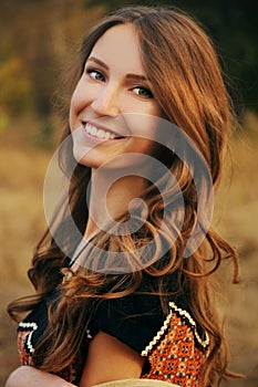 Cute young woman in the autumn field