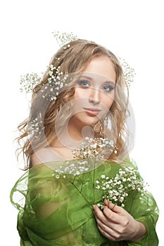 Cute young woman with flowers and healthy curly hairdo isolated on white