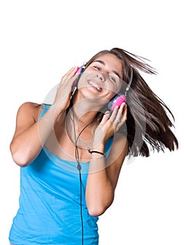 Cute young woman with headphones dancing on music