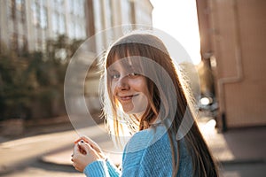 Cute young woman with long blonde hair and fringe hairstyle