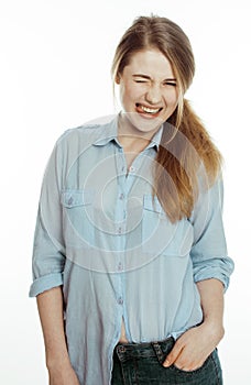 Cute young woman making cheerful faces on white