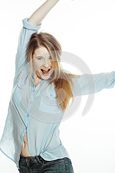 Cute young woman making cheerful faces on white
