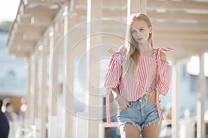 Cute young woman outdoors on a sunny day in summer