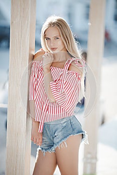 Cute young woman outdoors on a sunny day in summer