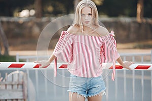 Cute young woman outdoors on a sunny day in summer