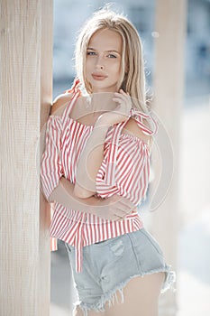 Cute young woman outdoors on a sunny day in summer