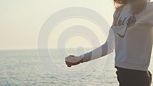Cute , young woman running around on the beach, the lady looks happy and joyful