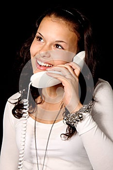 Cute young woman talking on the phone