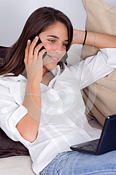 A cute young woman talking on the phone