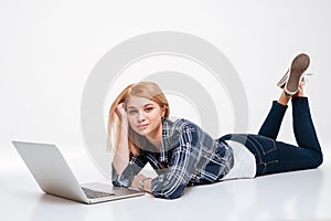 Cute young woman using laptop computer