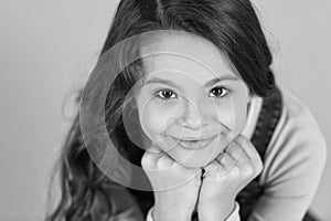 Cuteness overload. Child happy smiling enjoy childhood. Girl adorable smiling happy face lean on fists relaxing. Kid