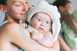 Cutest baby after bath with towel on head.