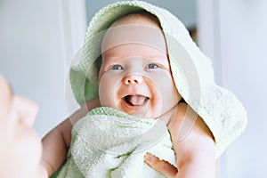 Cutest baby after bath with towel on head. photo