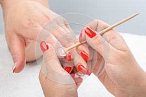 Cuticles care with cuticle pusher photo