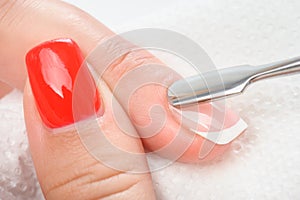 Cuticles care with cuticle pusher photo