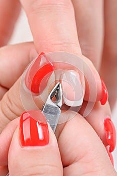 Cuticles cutting with nail clippers photo