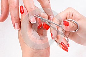 Cuticles cutting with scissors photo