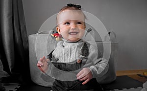 Cutie little baby girl smiles at home